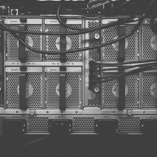 A black and white photo of some server racks.