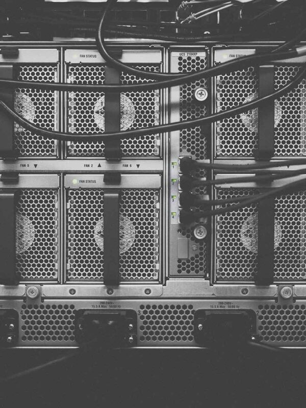 A black and white photo of some server racks.