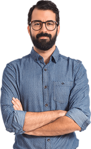 A man with beard and glasses standing in front of black background.