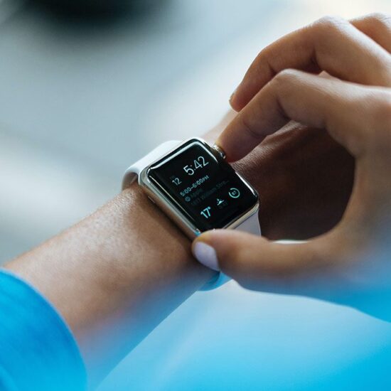 A person is looking at the time on their wrist.