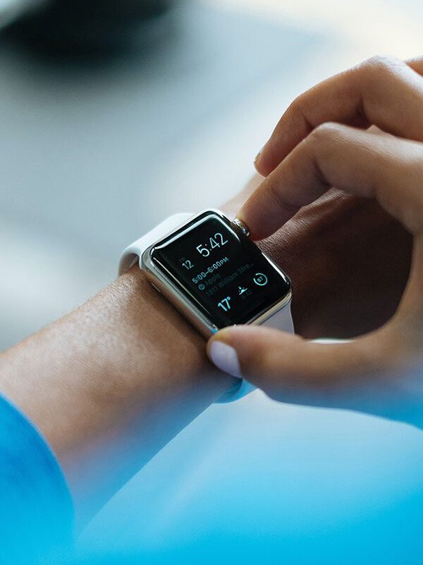 A person is looking at the time on their wrist.