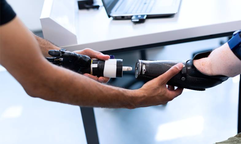 A person holding onto some of the same type of device