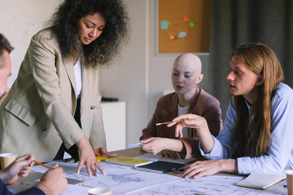 A group of people sitting around a table.