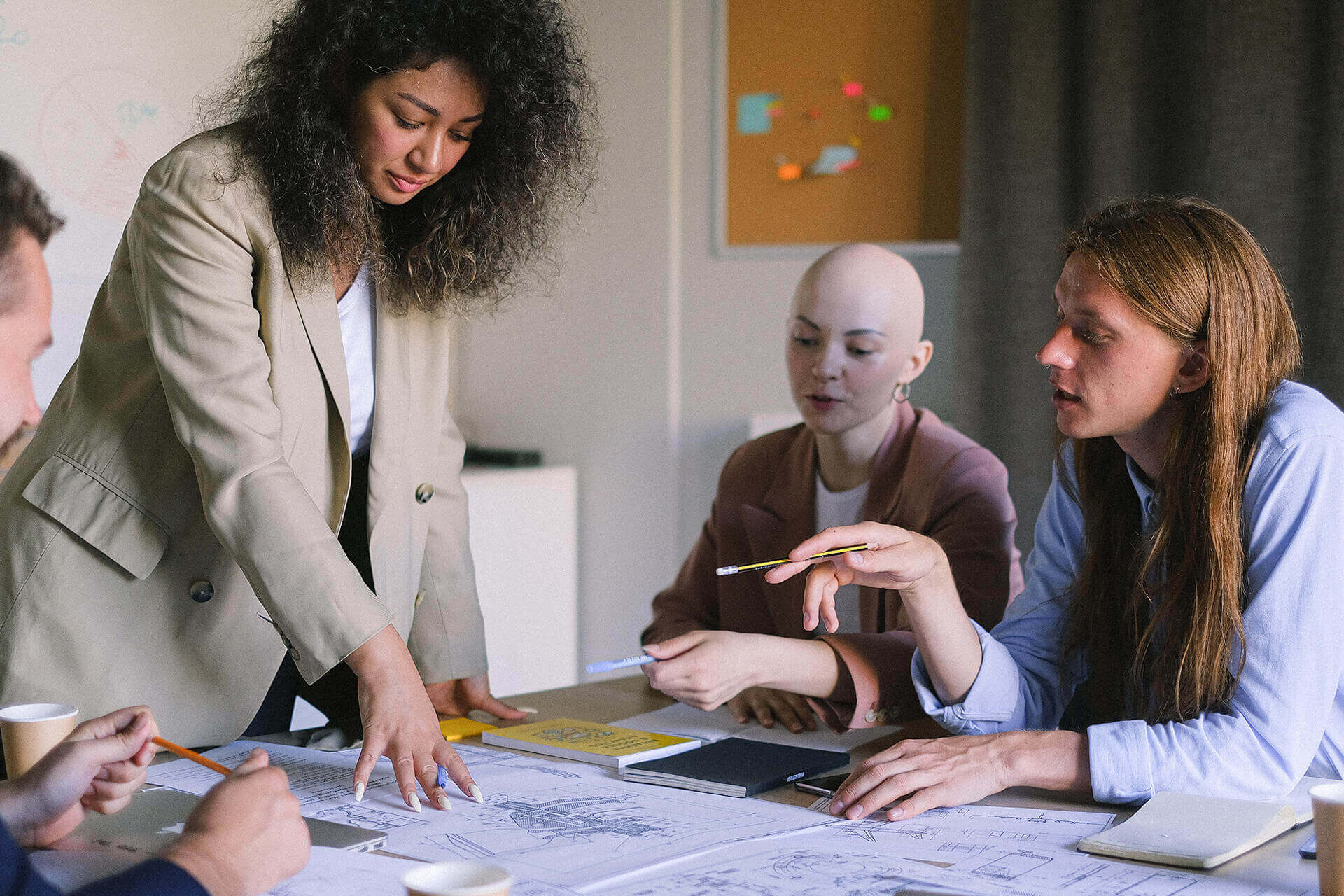 A group of people sitting around a table.
