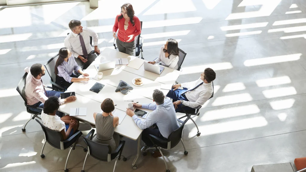 A group of people sitting around a table.