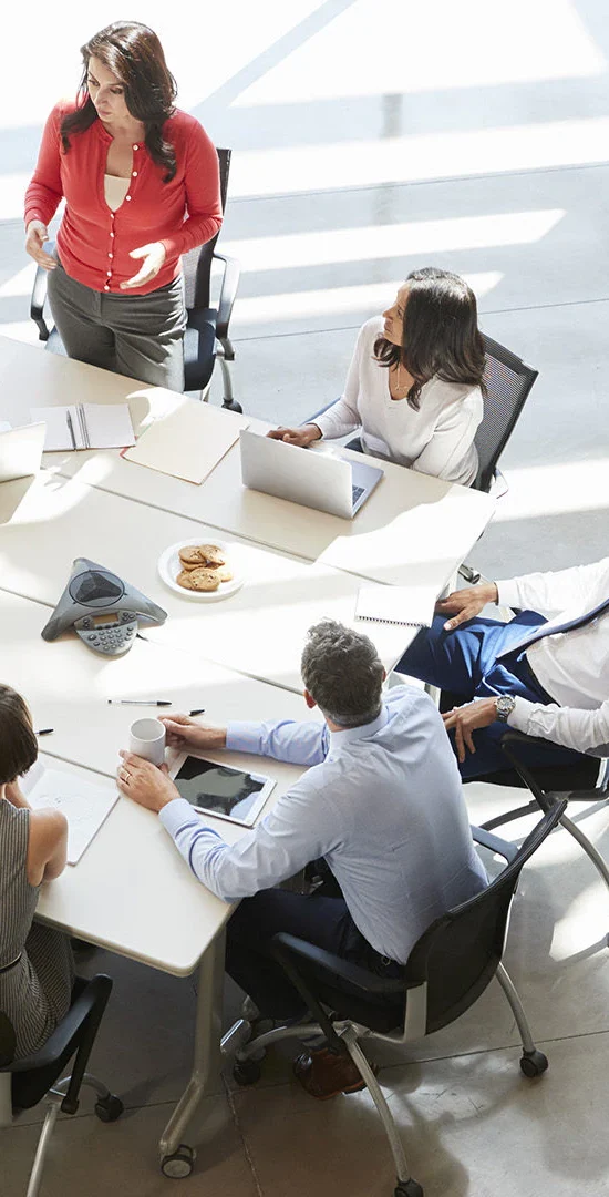 A group of people sitting around a table.