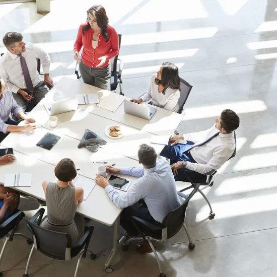 A group of people sitting around a table.