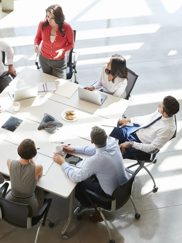 A group of people sitting around a table.
