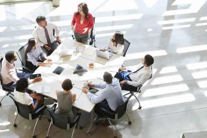 A group of people sitting around a table.